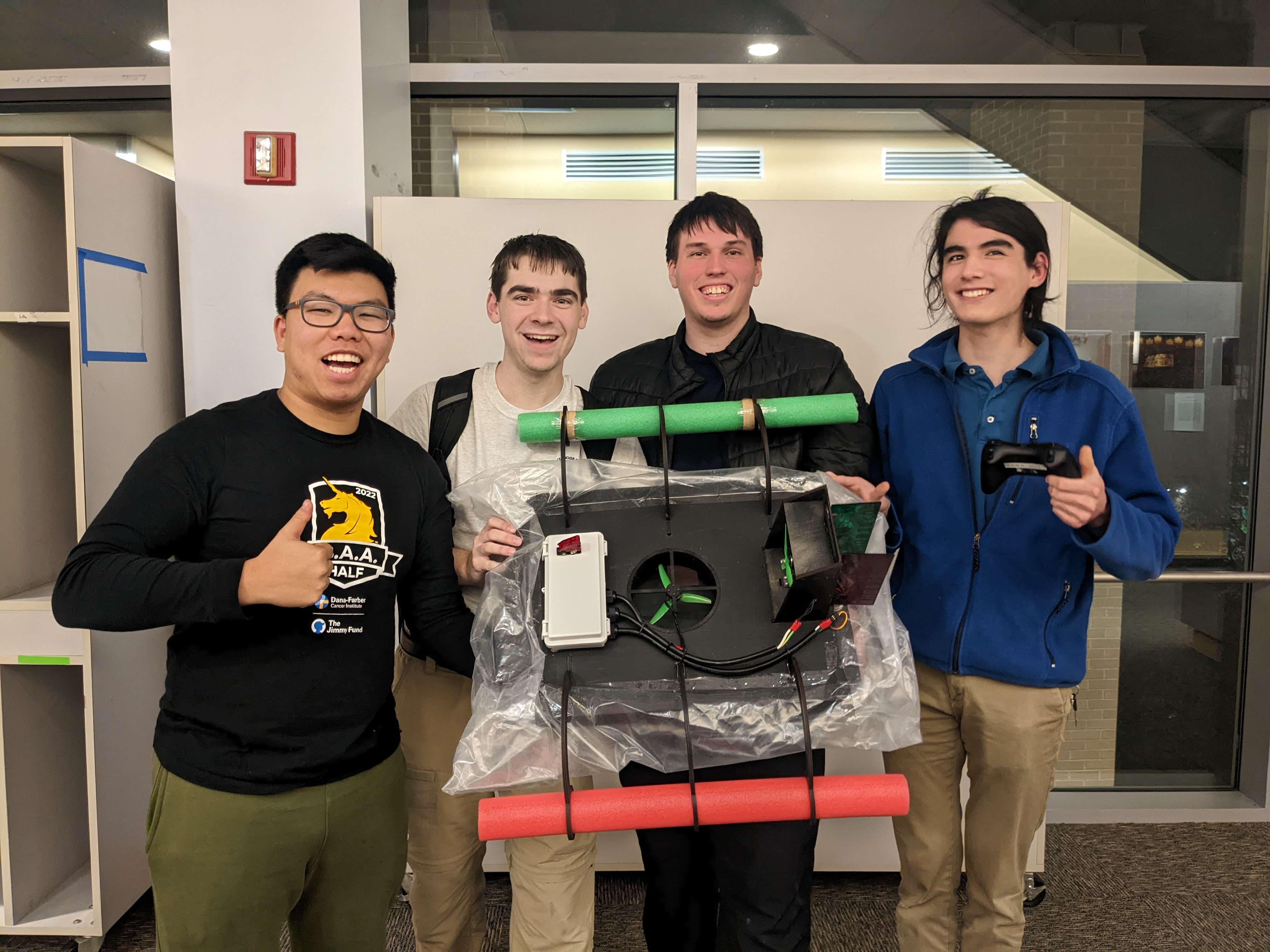 Multidisciplinary team of engineers with their hovercraft